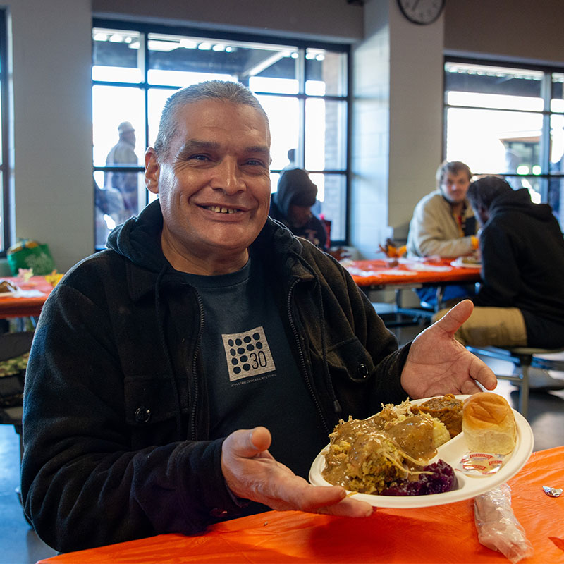 Guest with Thanksgiving meal