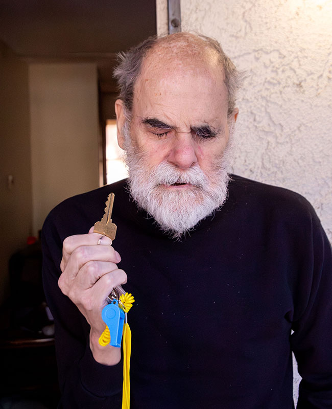 James holding key