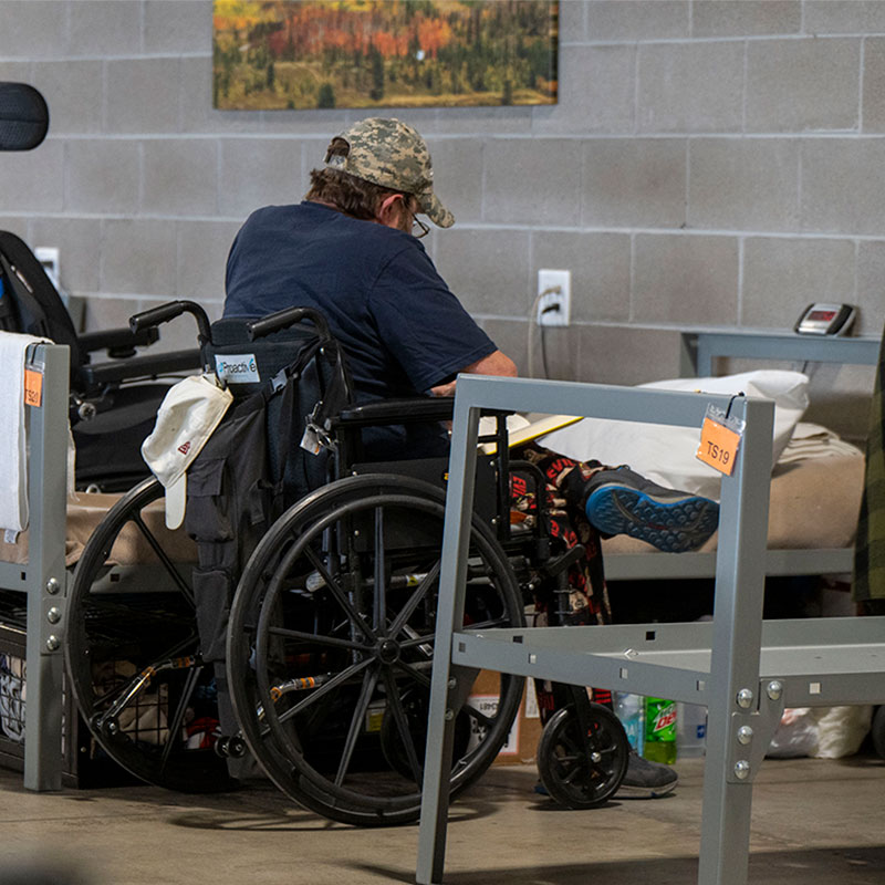 Guest in wheelchair inside shelter