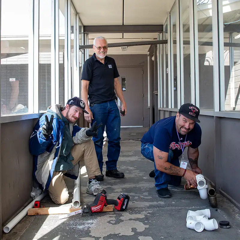 Program participants working on project with supervisor