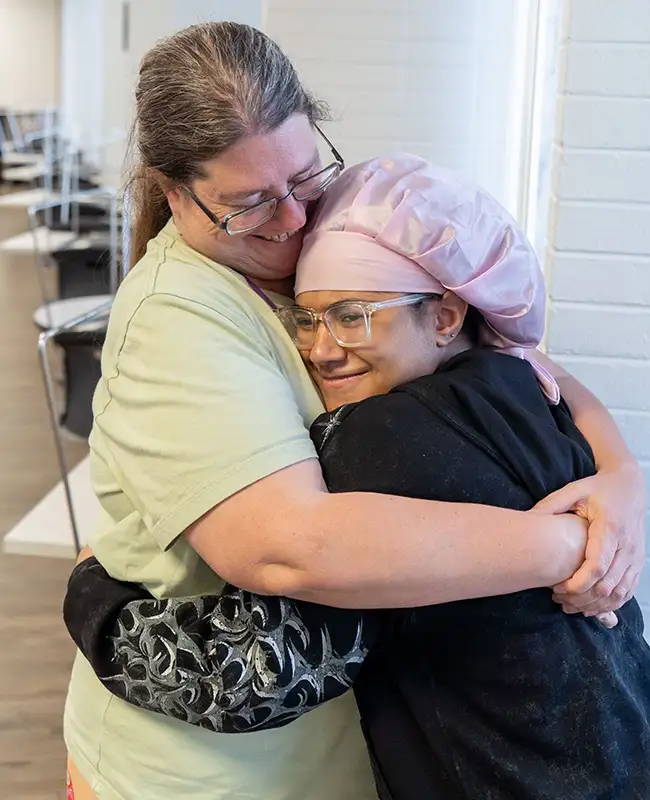 Kat hugging daughter